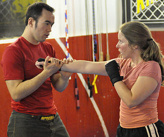 Professor Billy Hendricks teaches women's MMA class