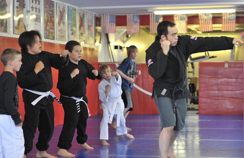 Professor Billy Hendricks leads kid's MMA class